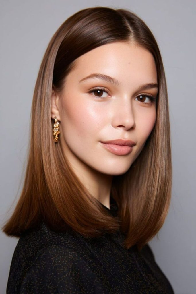 Sleek straight bob with reflective shine.
