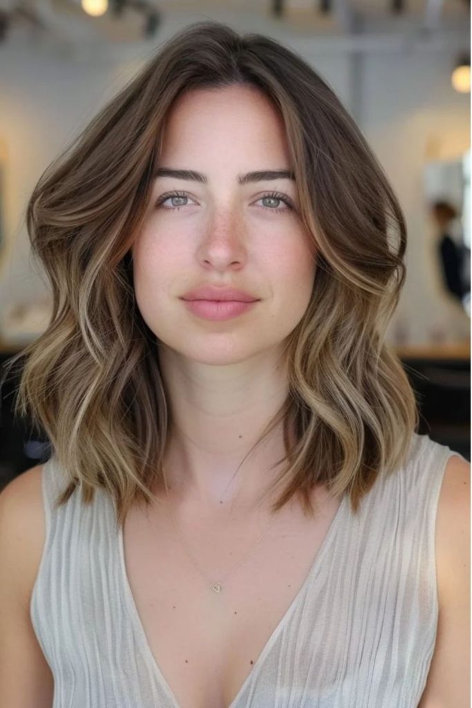 Sun-kissed lob with gentle flickers