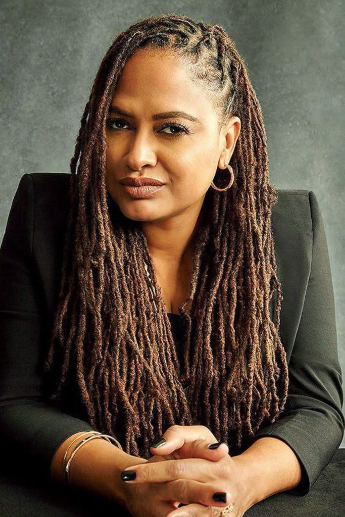 Honey-colored locs catching sunlight gently