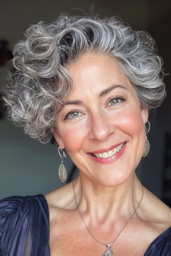 Silver-gray curls producing ethereal glow.
