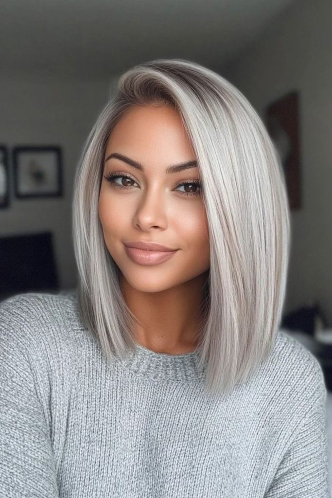 Icy platinum bob with mid-length layers.