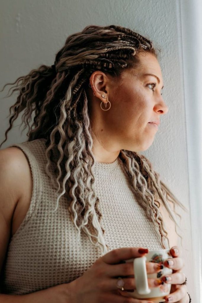 Earth-toned playful dreadlocks with wooden beads