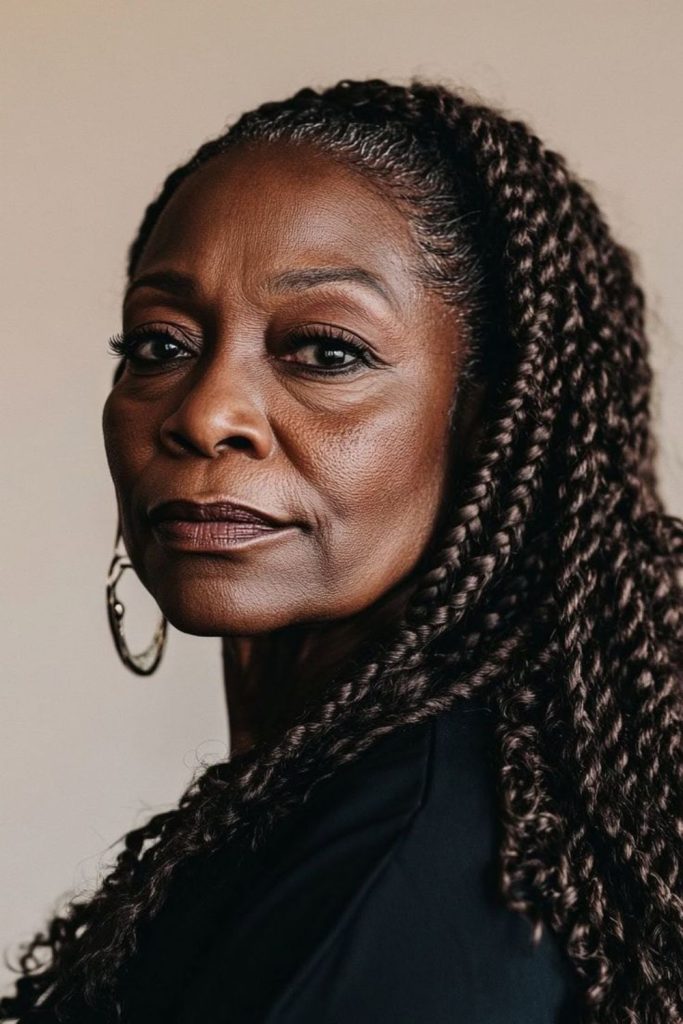 Brown playful locs with uneven spirals