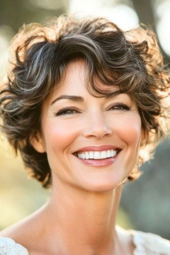 Short curly crop for playful charm.