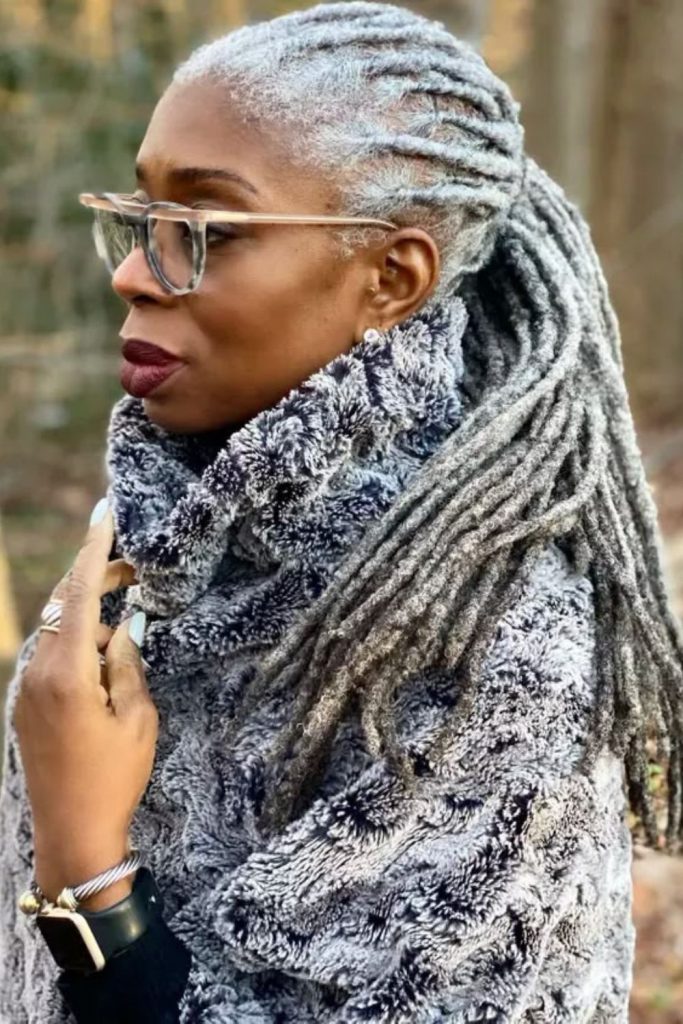 Pale silver locs shimmering in daylight