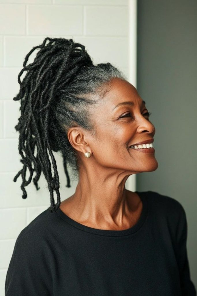 Ash-gray locs drifting like gentle smoke