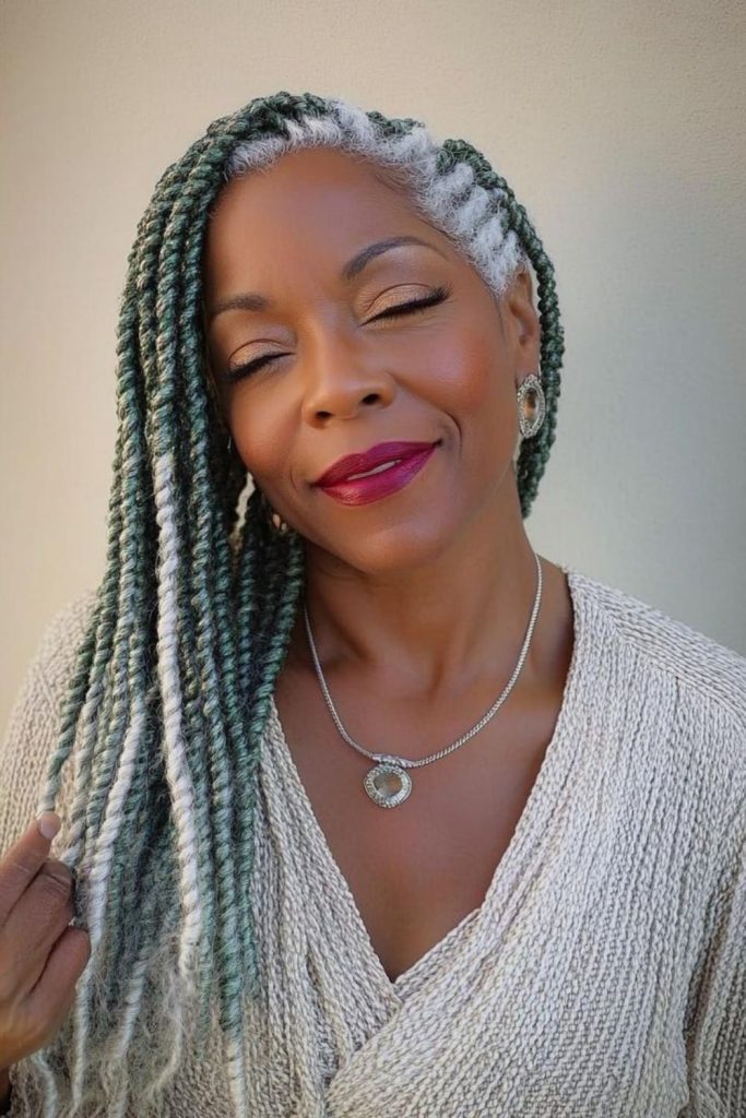 Sun-kissed locs with teal effect locs cascading freely