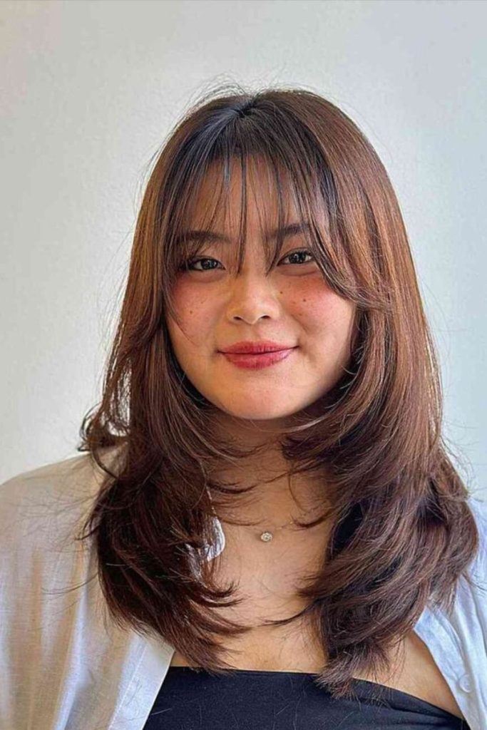 Soft wispy layers frame round face