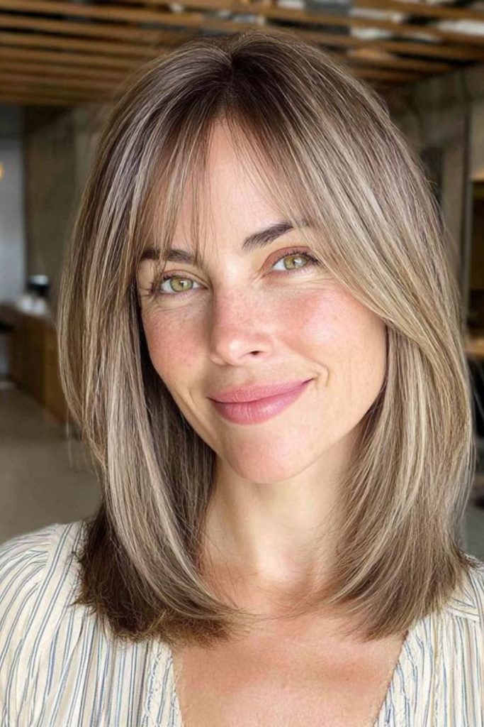 Thin wispy layered bob framing face.