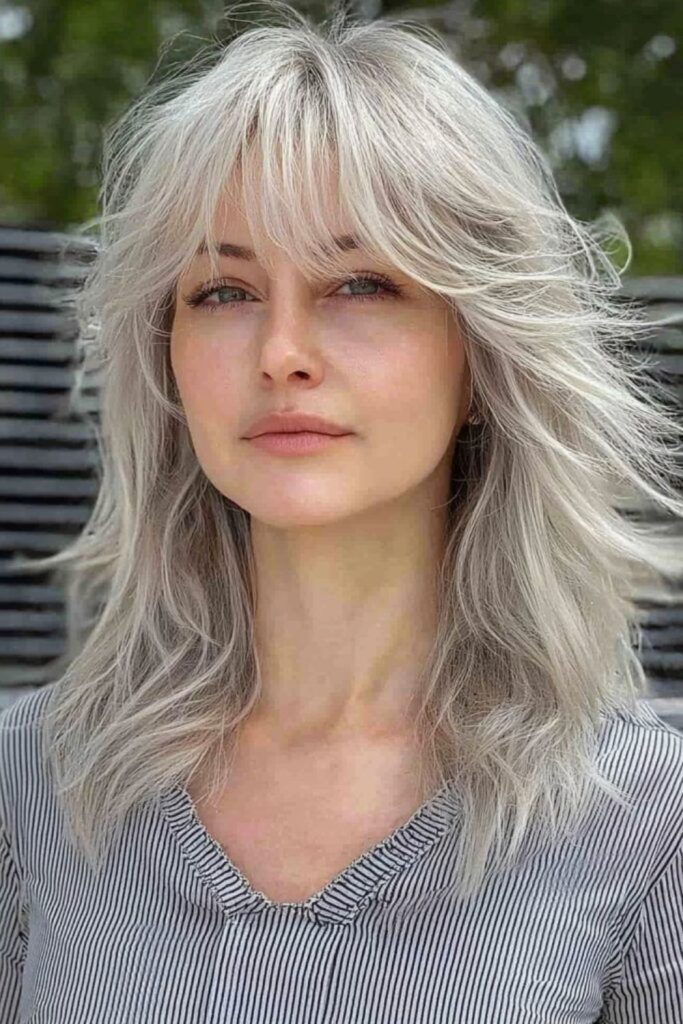 Platinum layered jagged icy wolfcut hairstyle.
