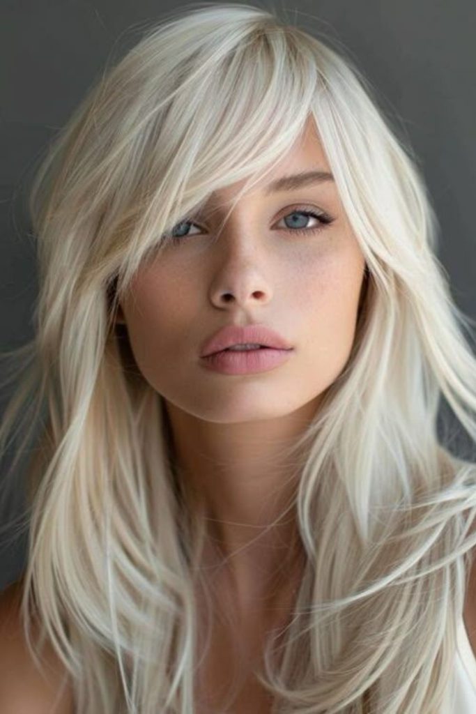 Platinum fringe edgy frozen tone hairstyle.