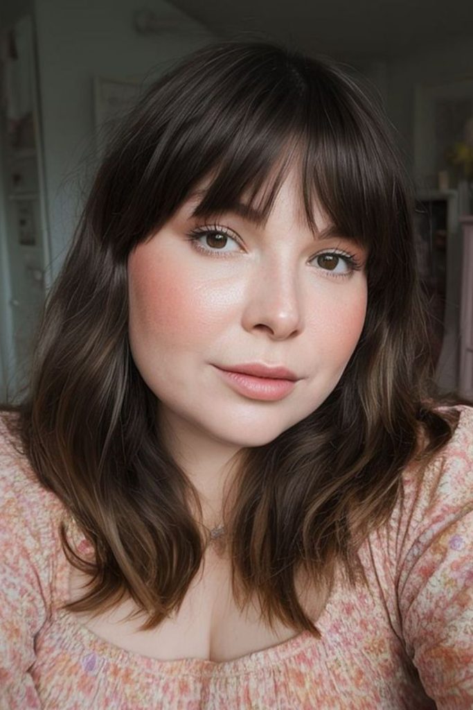 Bottleneck bangs elongate facial appearance naturally