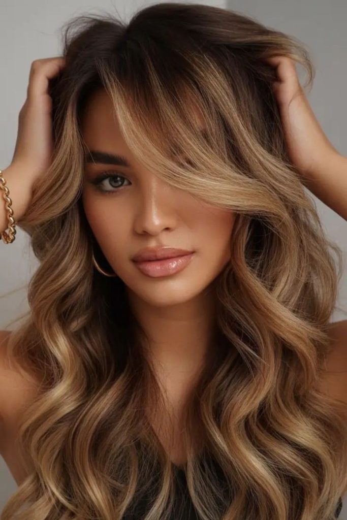 Tousled waves with soft caramel highlights.