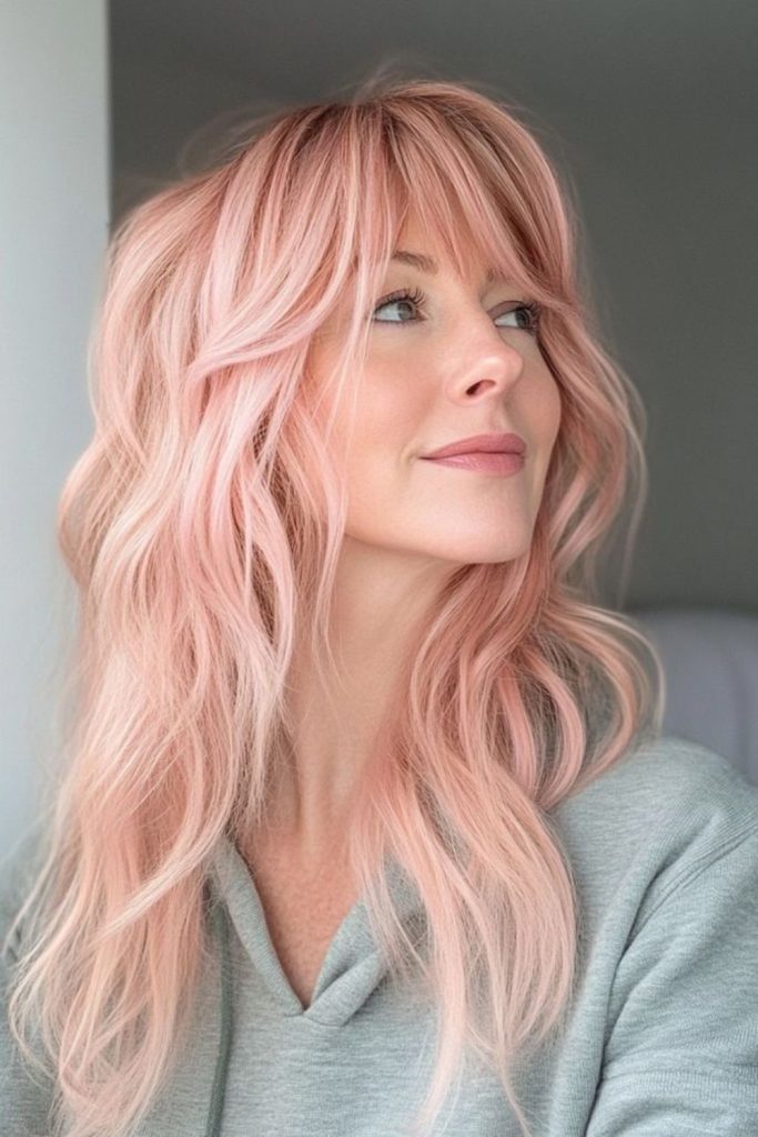 Soft coral layered playful wolfcut style.