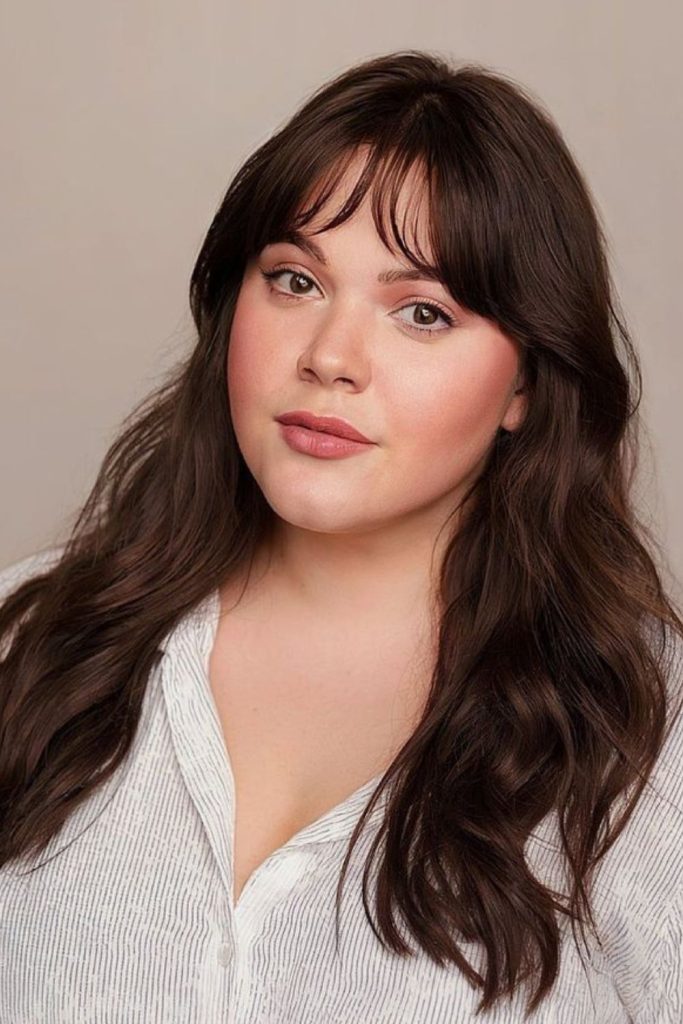 Curved bangs contour cheeks subtly