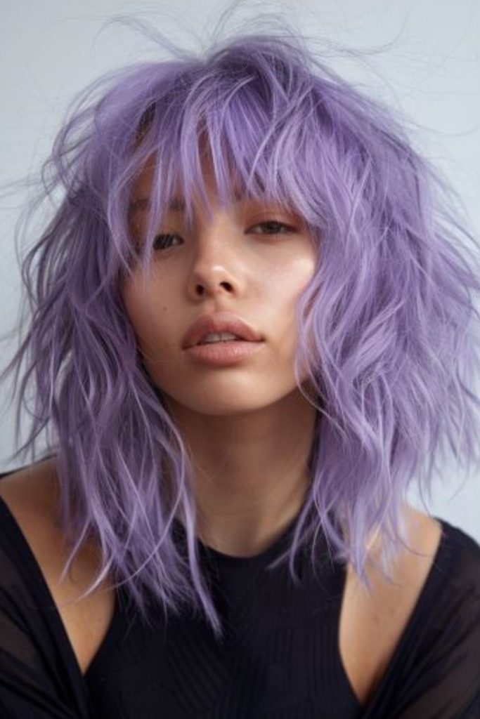 Bold purple layered spiky wolfcut style.