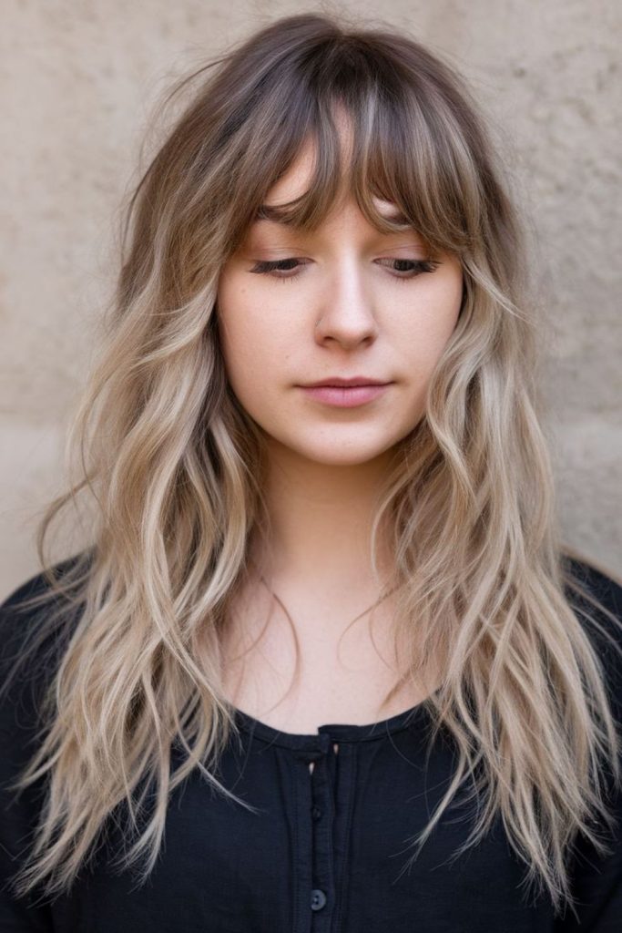Feathered forehead strands curling delicately naturally