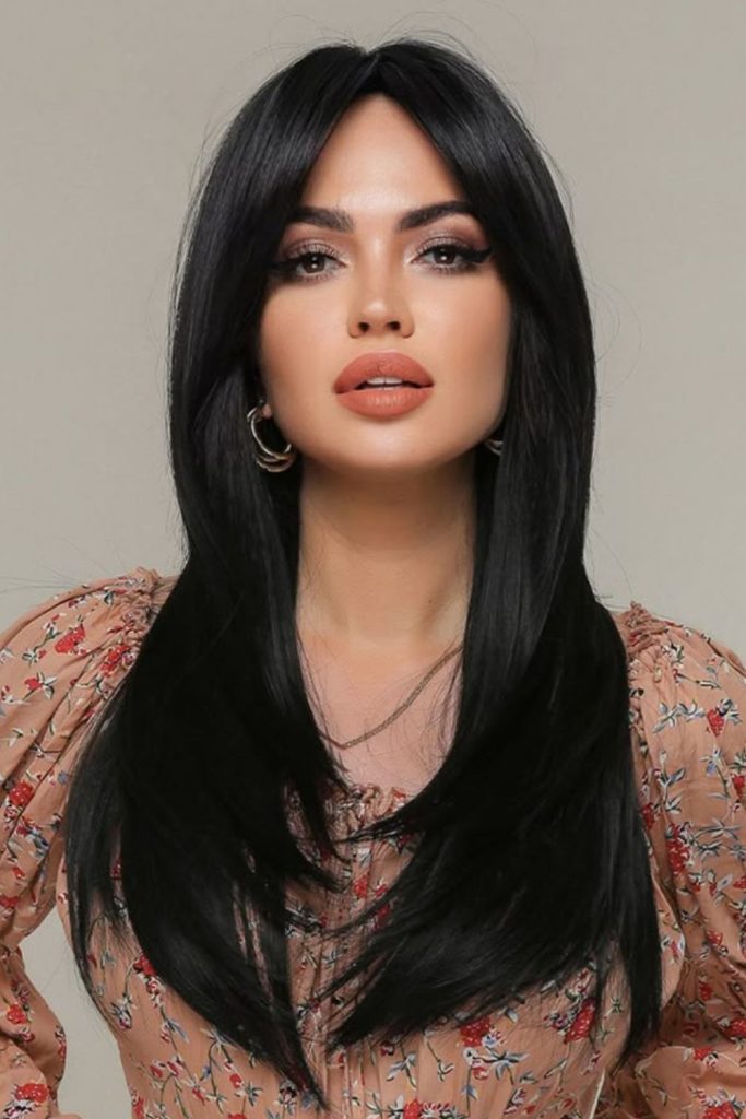 Ultra-straight shiny black shoulder-length hair.