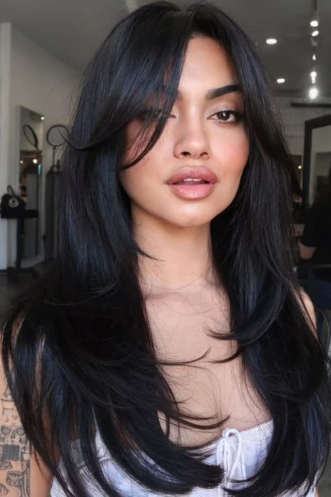 High-gloss controlled straight black hair.