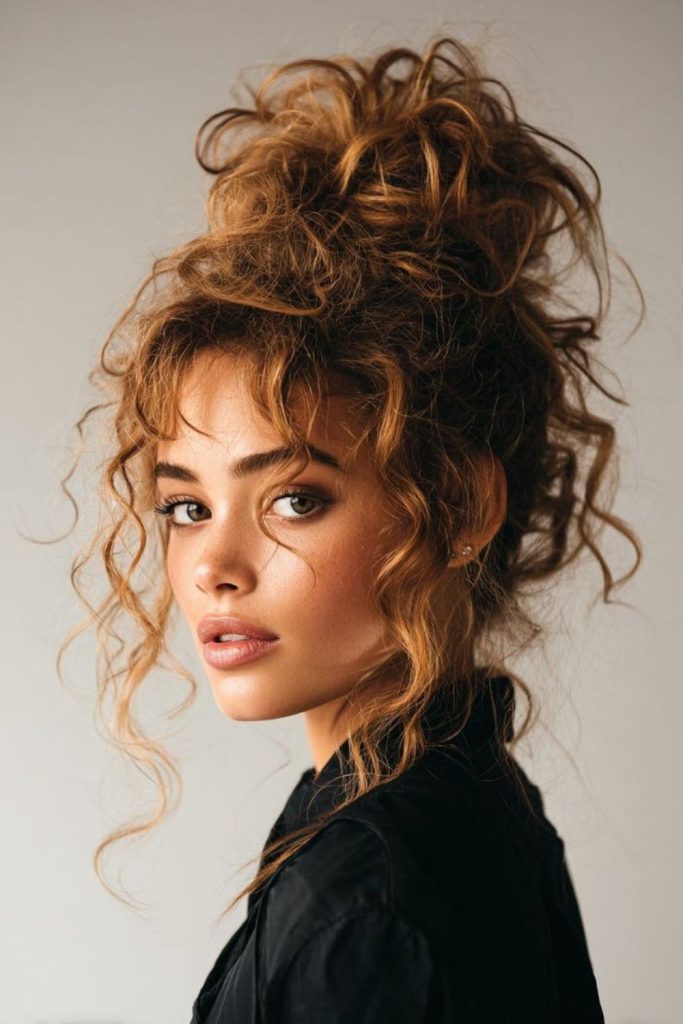 Soft updo with honey strands glow.