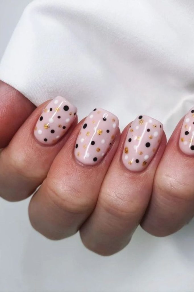 Minimalist nails with small metallic dots