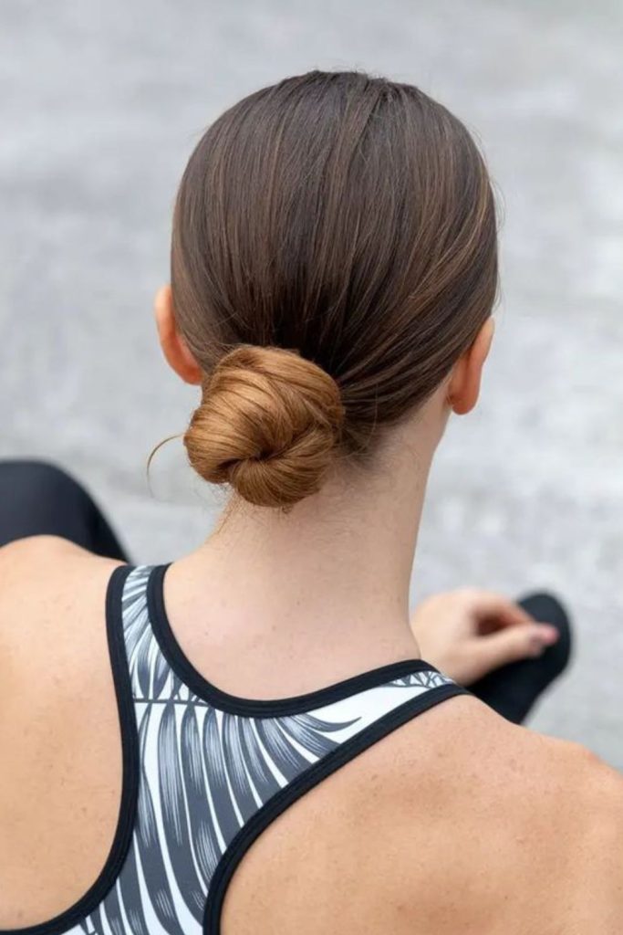Relaxed nape bun with soft texture.