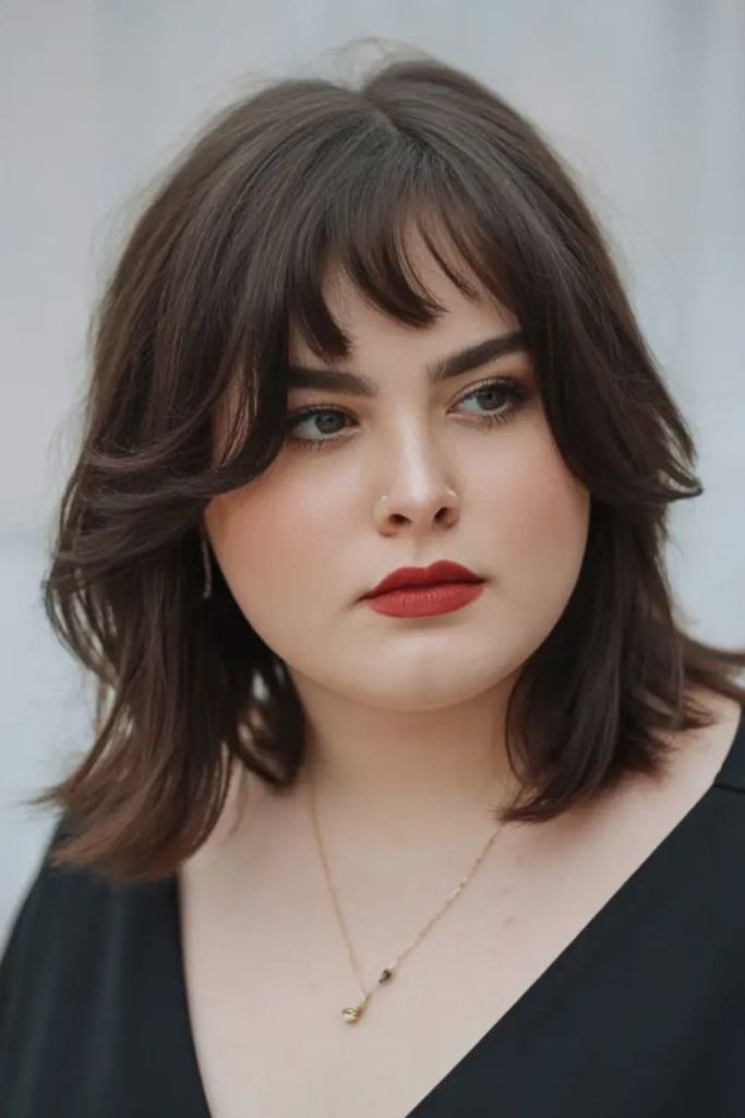 Short feathered bangs add edgy charm