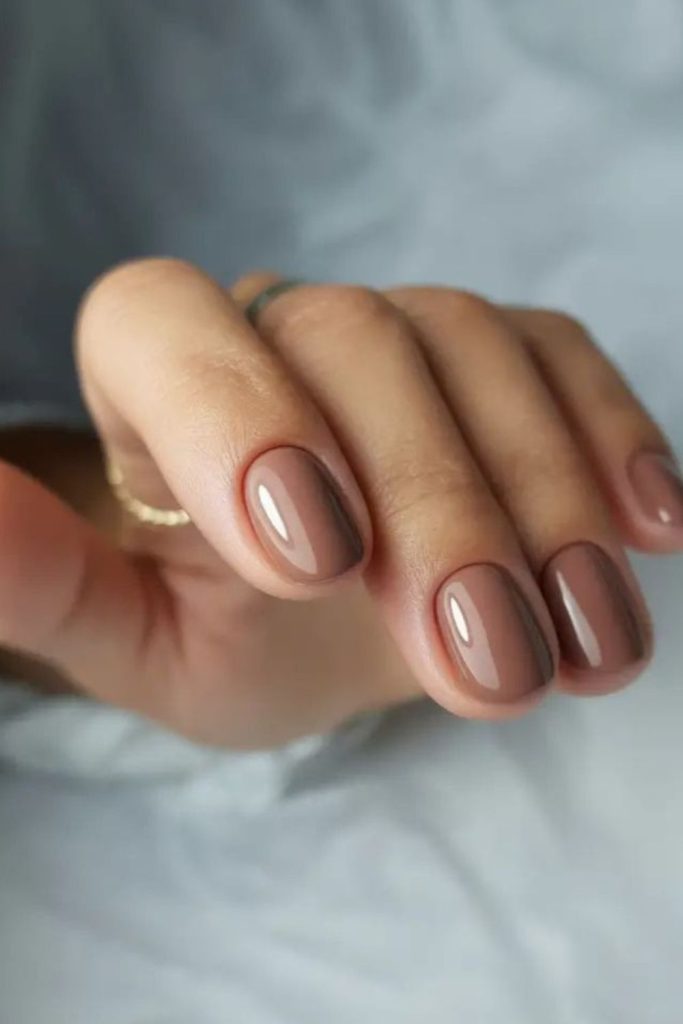 Nude quartz shimmer short nails.