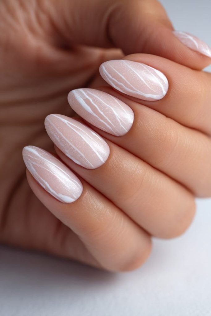 Neutral beige nails with soft pearl