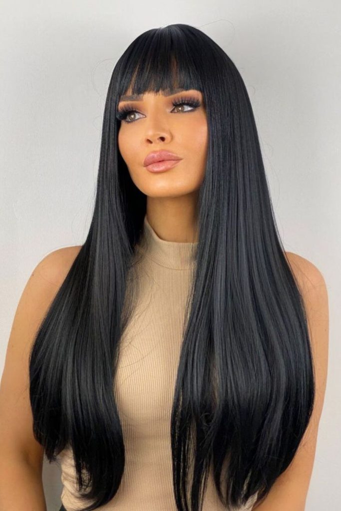 Dense deep black straight hair.