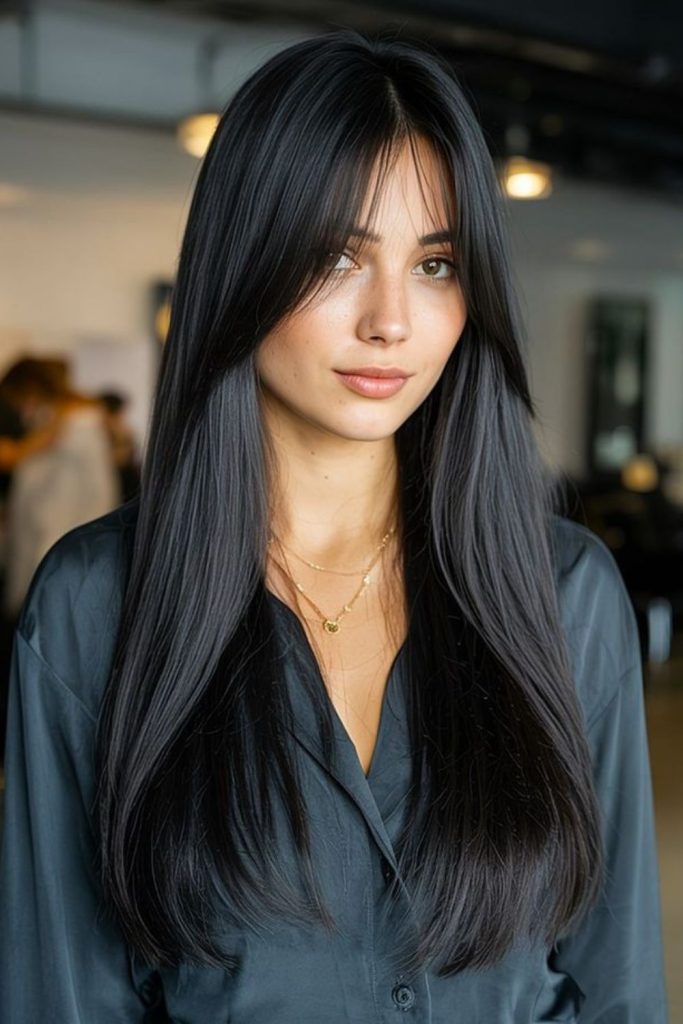 Sleek uninterrupted long straight hair.