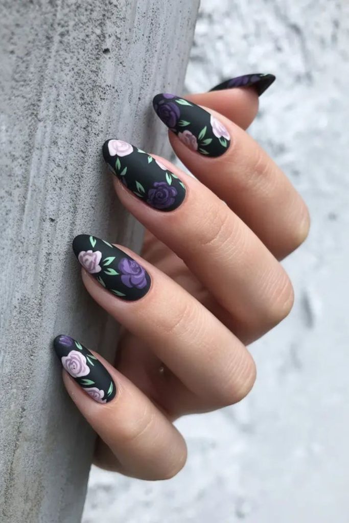 Dark floral nails with velvety finish