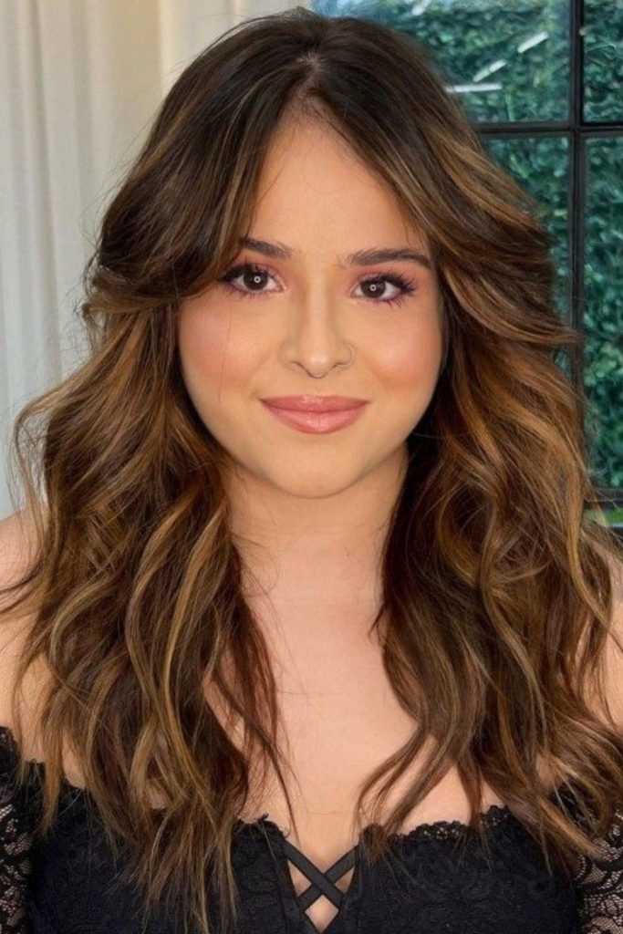 Side-glide bangs narrow cheeks visually