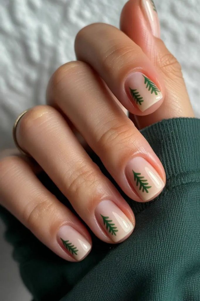 Nude nails with green accent