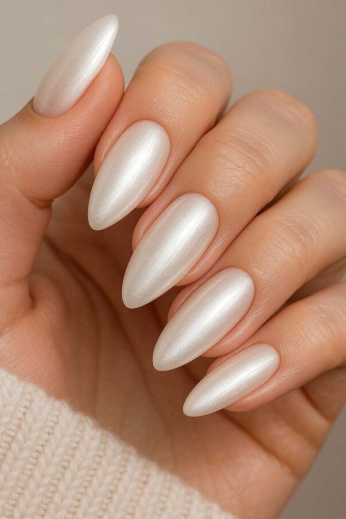 Frosted almond nails with timeless refinement.