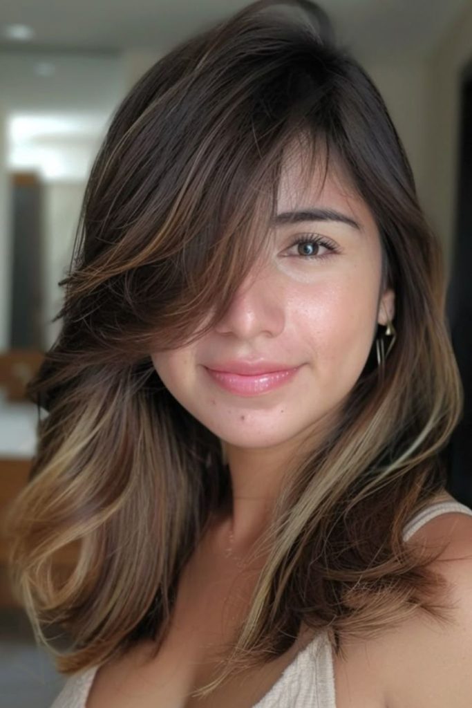 Oblique sweep bangs sculpting facial angles