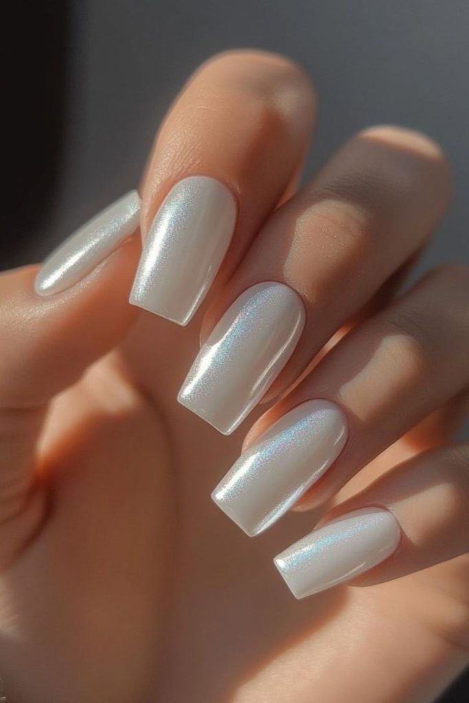 Vintage-inspired milky nails soft warmth.