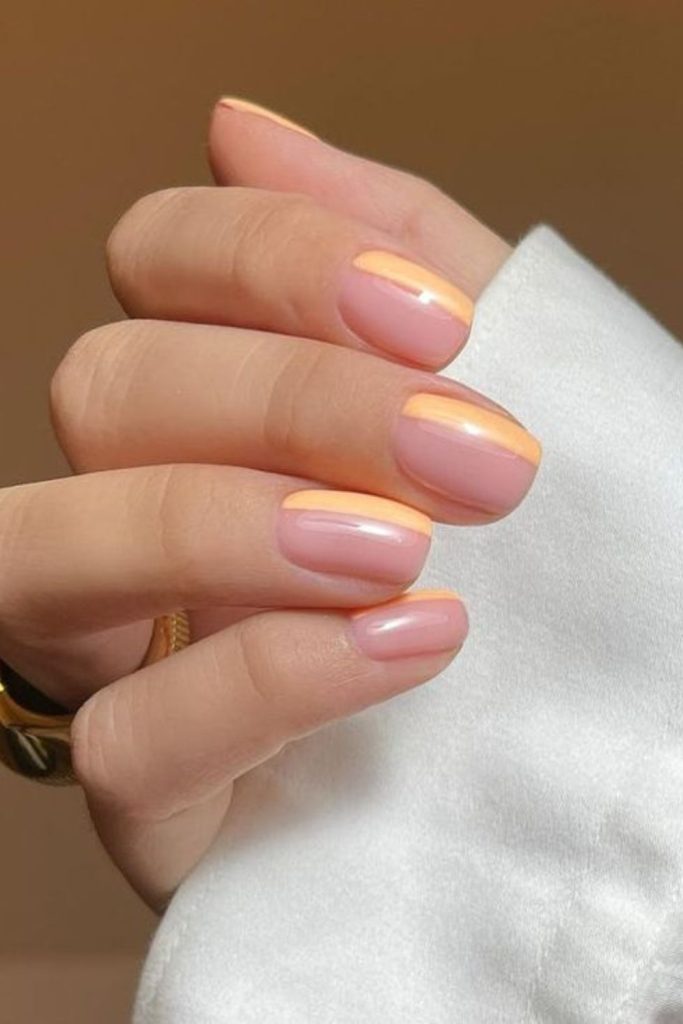Sheer peach natural nail finish.
