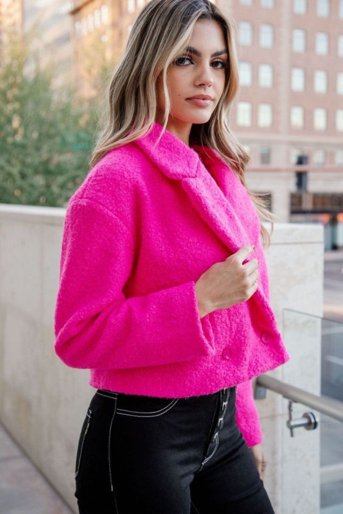 Cropped pink jacket with black pants