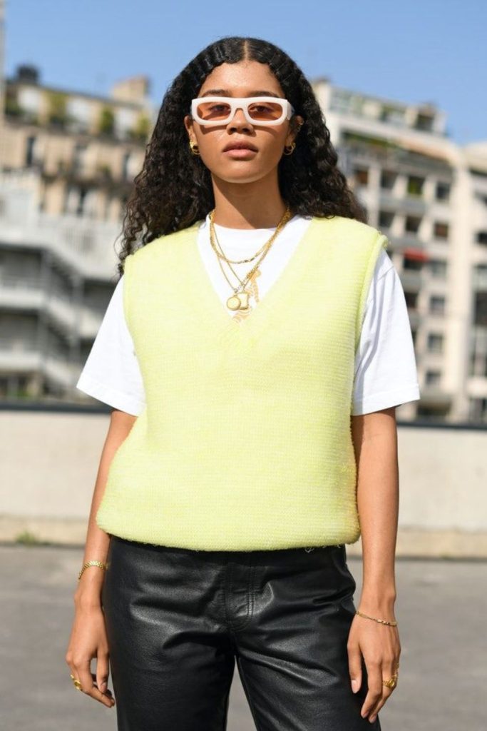 Neon threaded knit vest with dark pants