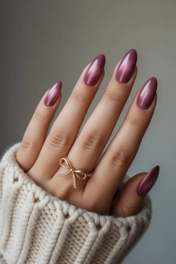 Muted plum nails with refined depth.