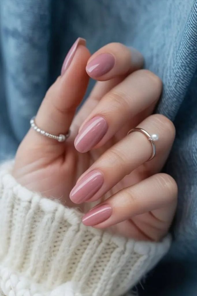 Muted foggy pink nail design.
