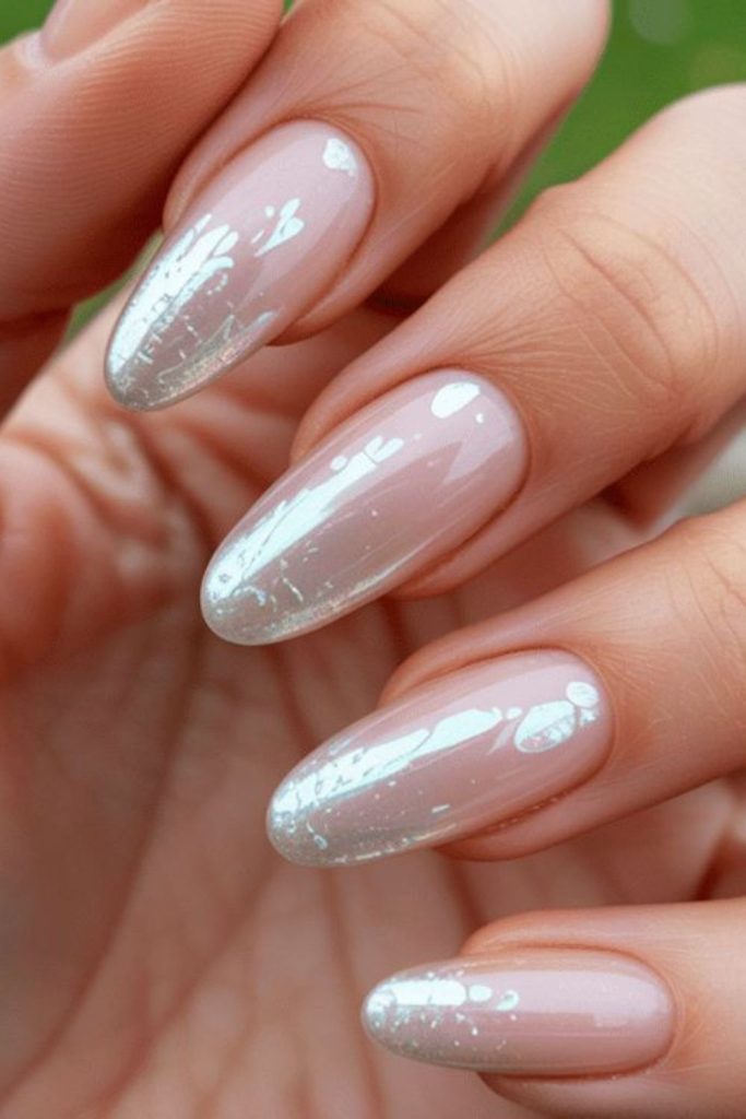 Almond-shaped nails with frosted shimmer