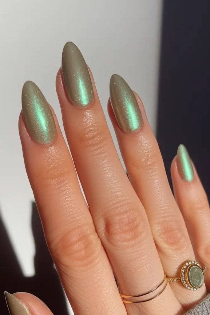 Mint green nails with gold shimmer.