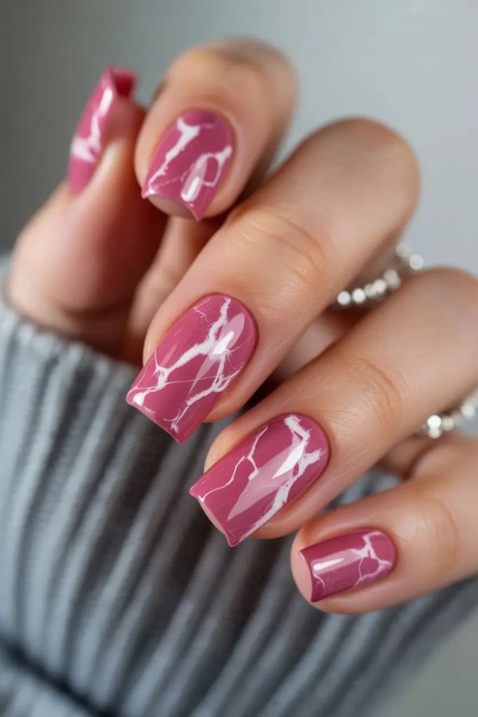 Swirled berry nails with glitter accents