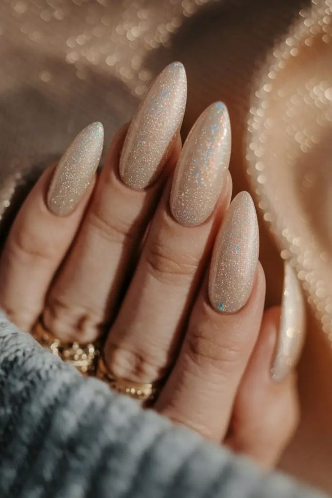 Champagne nails with subtle shimmering glow.