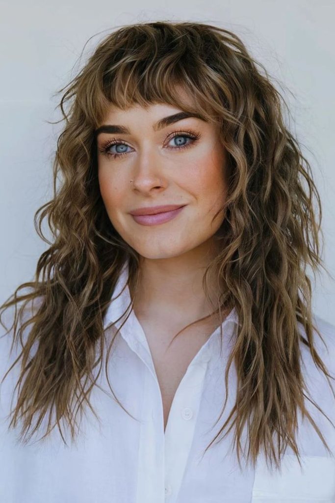 Shimmering golden fringe and long hair