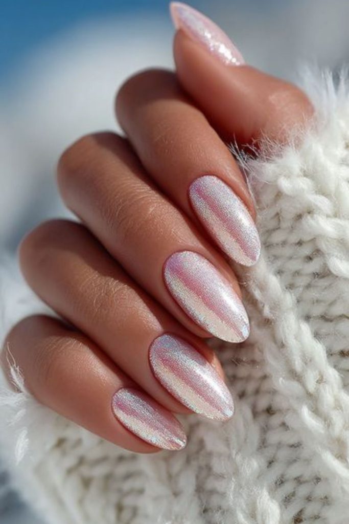 Holographic flakes on pale winter nails
