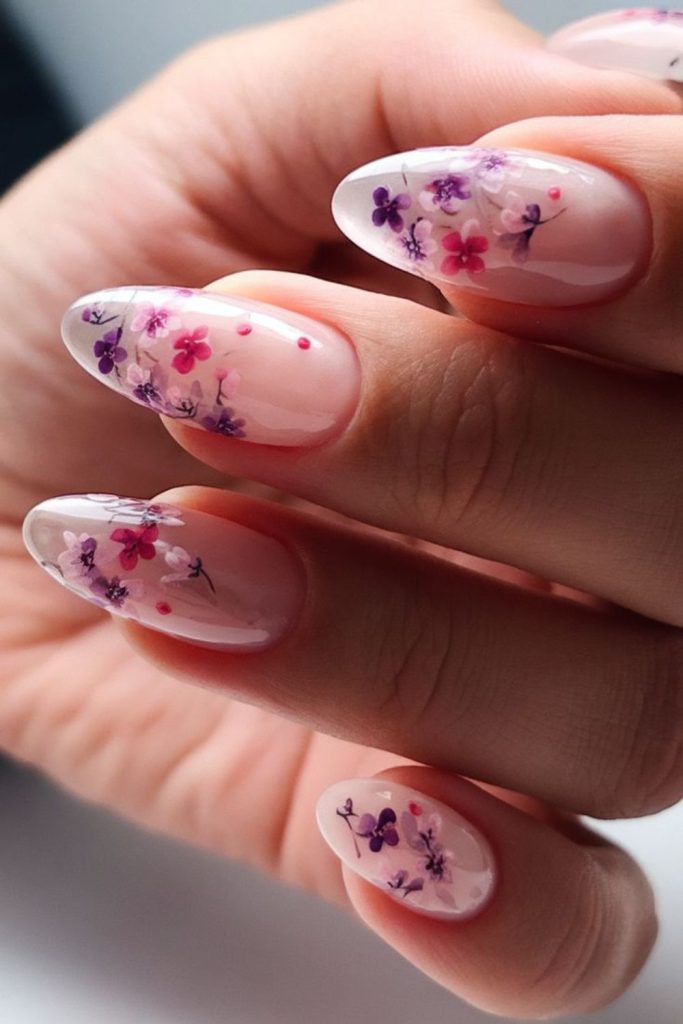 Translucent nails with holographic floral bursts