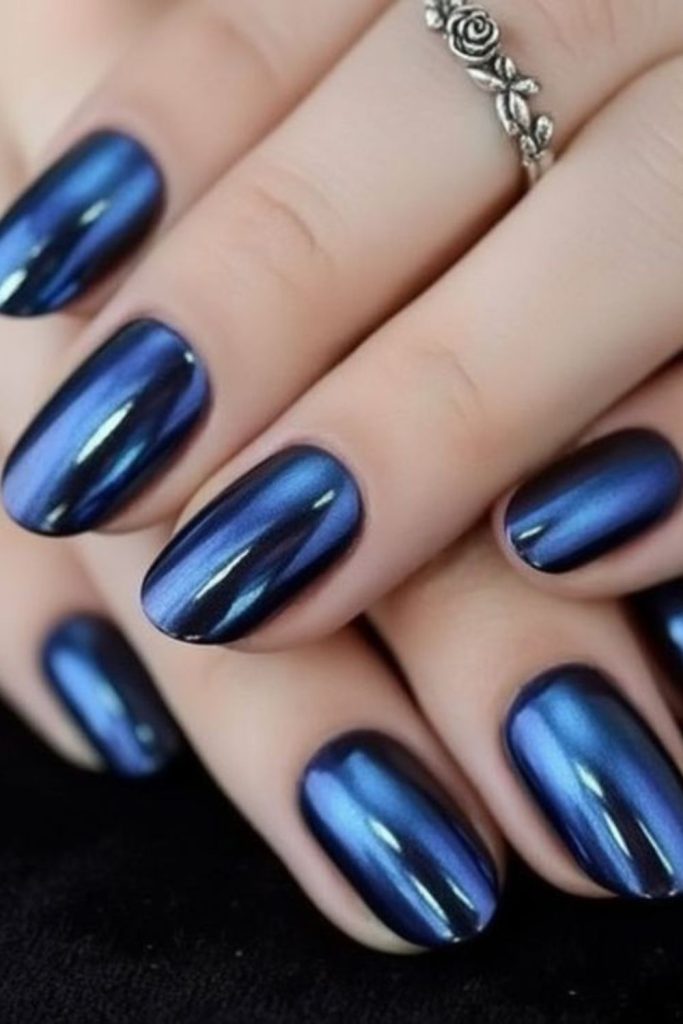 Inky blue chrome nail design